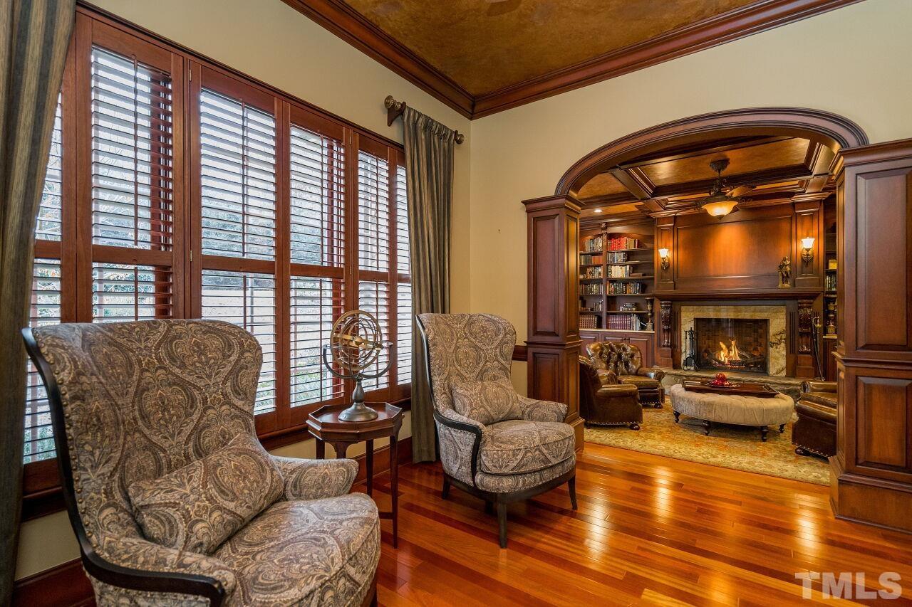 French doors lead to the stately parlor with plantation shutters.