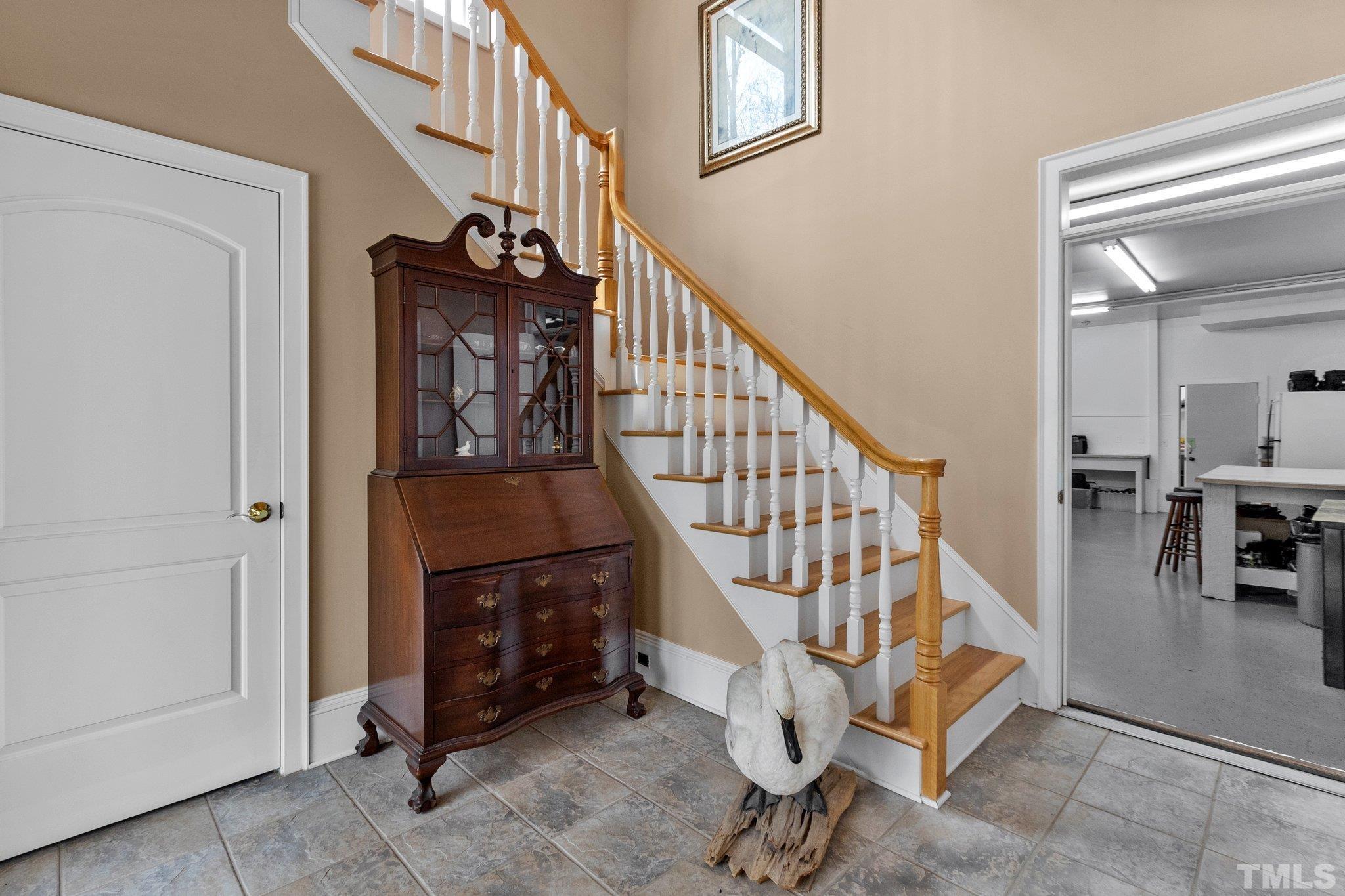 You can take the steps up to the main living area or head into the garages and home offices.
