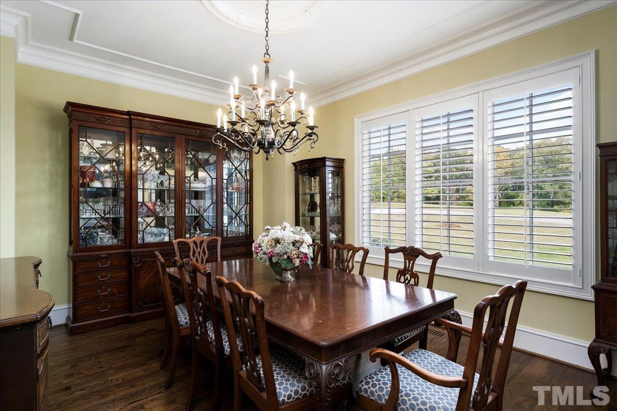Dining room boasts decorative ceiling and room for a large table and hutch. This room may have the best view of the lake at sunset.