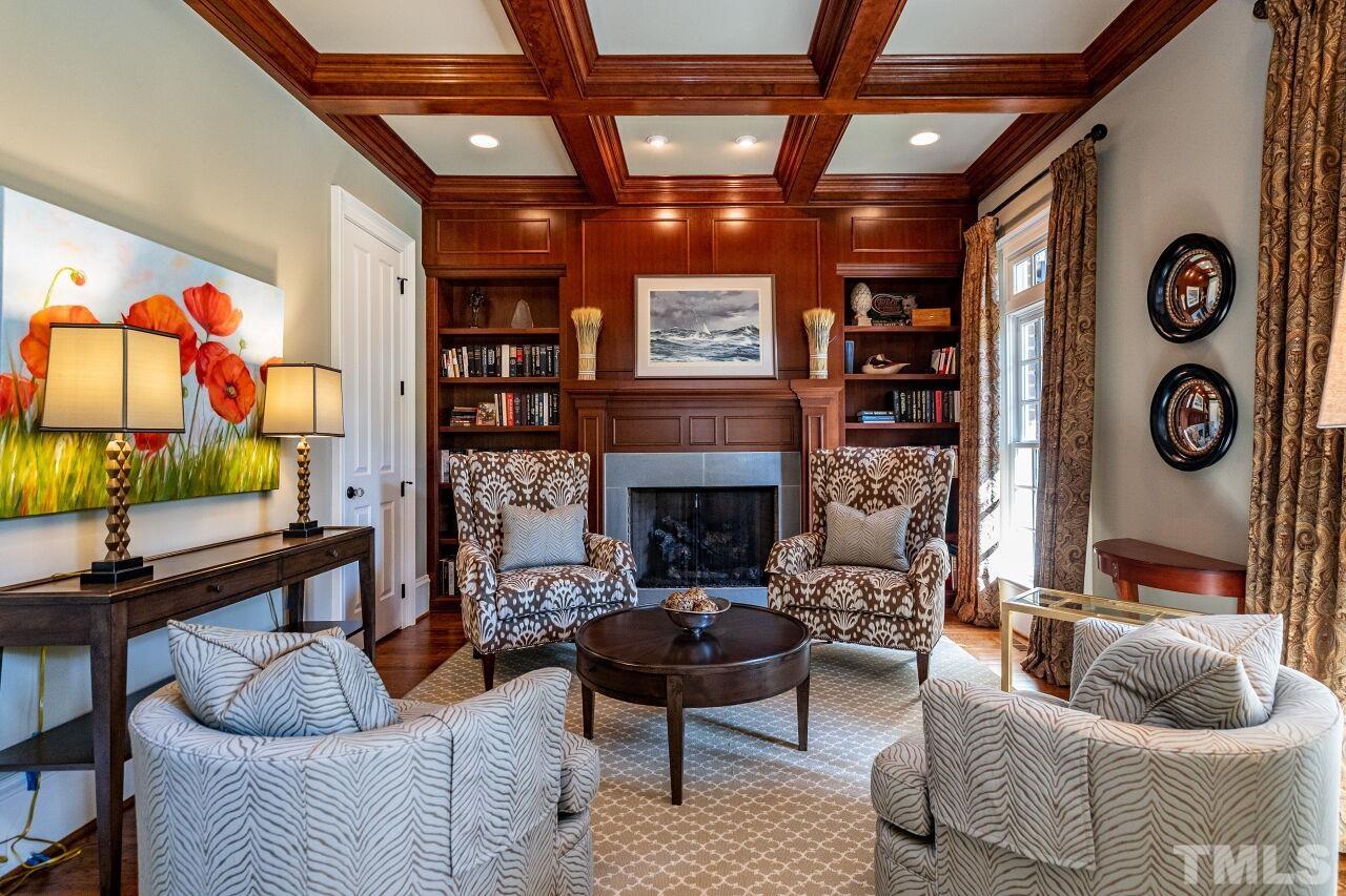 Richly appointed study with custom trim detail and gas fireplace