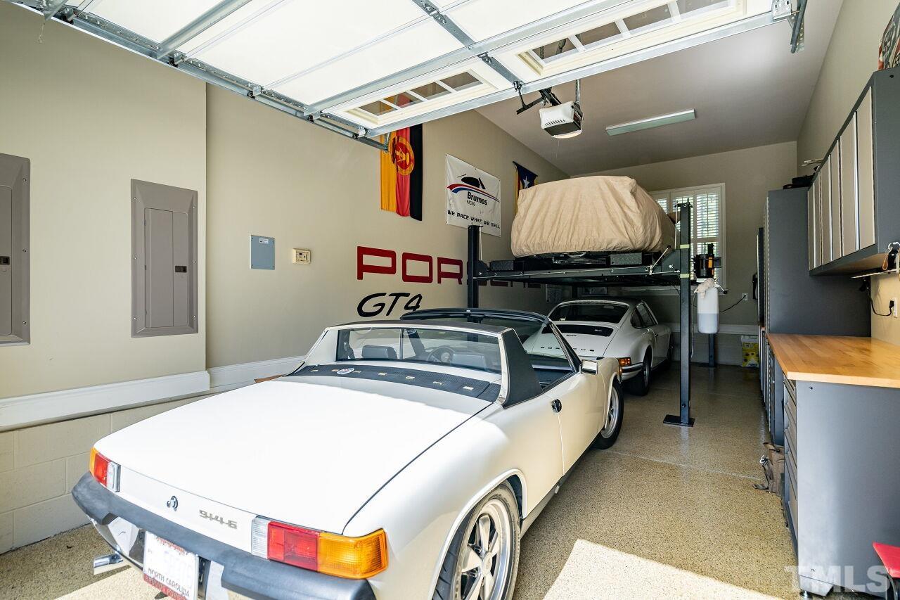 For the true car enthusiast, a garage lift provides space for a sixth auto. Porsche not included!  : )