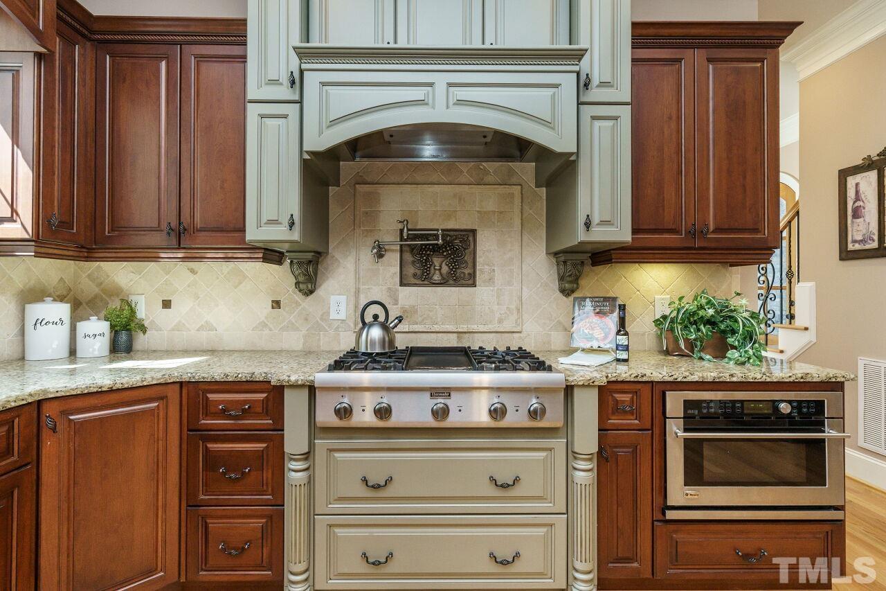 The Thermador gas cook-top is the focal point.  The pot filler faucet and custom-hood are icing on the cake.