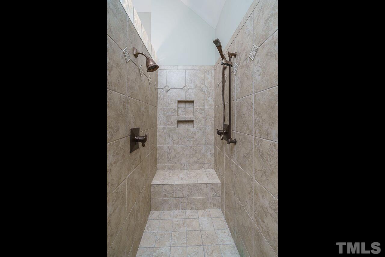 The custom tile shower is a true escape!