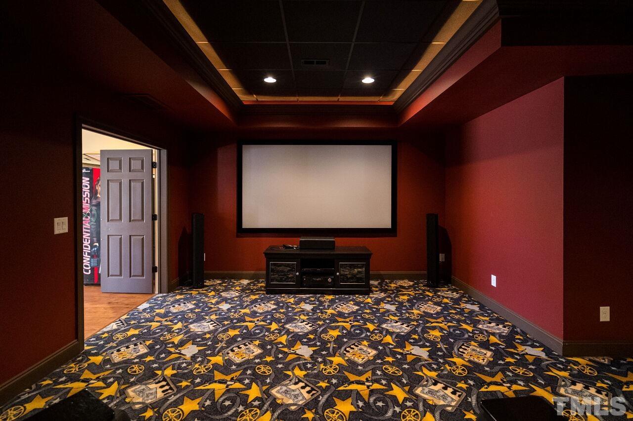 The home theatre has whimsical theatre-themed carpeting and will be the perfect place to spend quality time with your family.