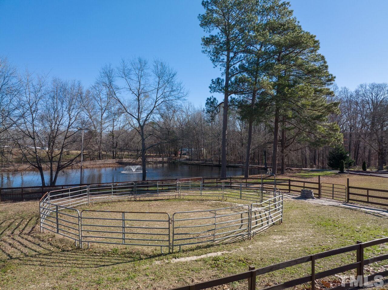 Riding ring - check; 2 horse fields - check; detached 5-car garage - check; pond - check; 3-stall horse barn - check.  Your checklist is complete!