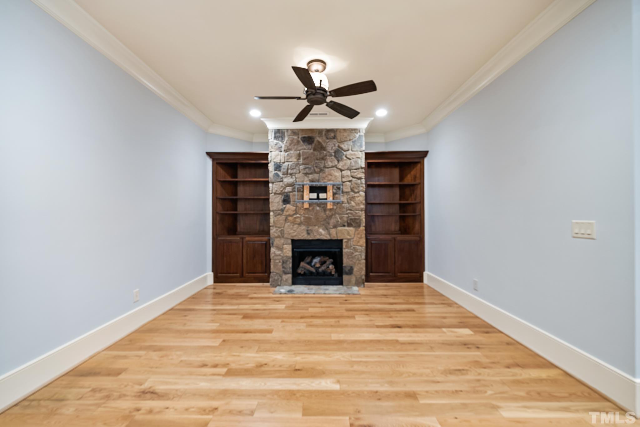 Daylight basement with separate exterior entrance would be perfect for In-law/nanny/teen suite. With Gas stone fireplace, built-in shelving flanking fireplace, full bath.