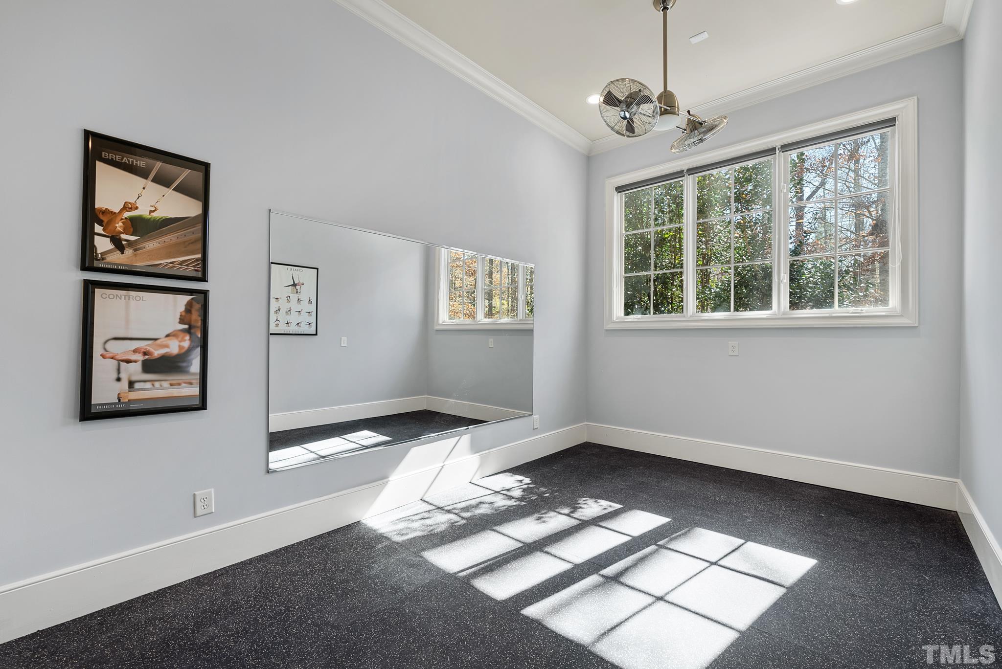Rubber tile flooring, Mirrored walls, Private location connecting to lower garage & easy outdoor access.