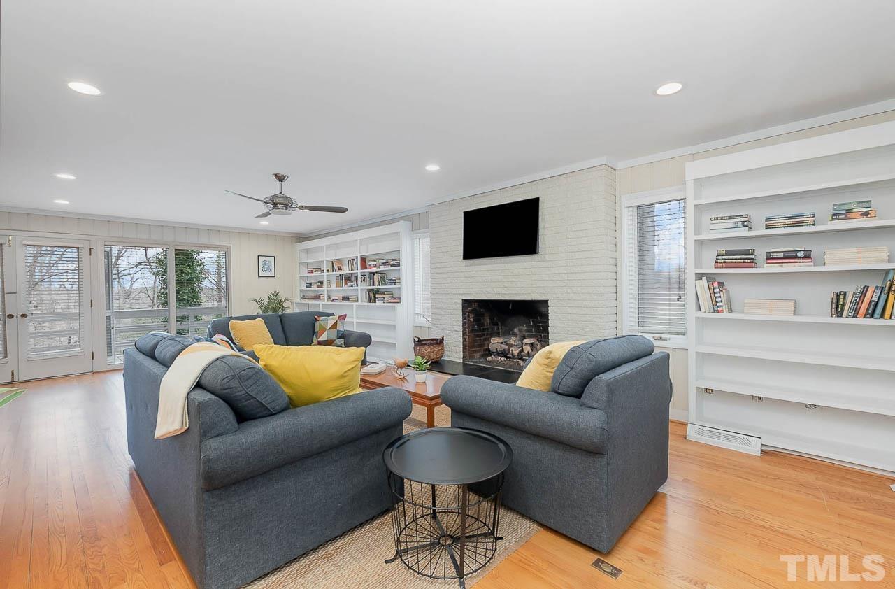 Fabulous Family Room - Great Spaces and Wall of Windows and Door Leading to Deck