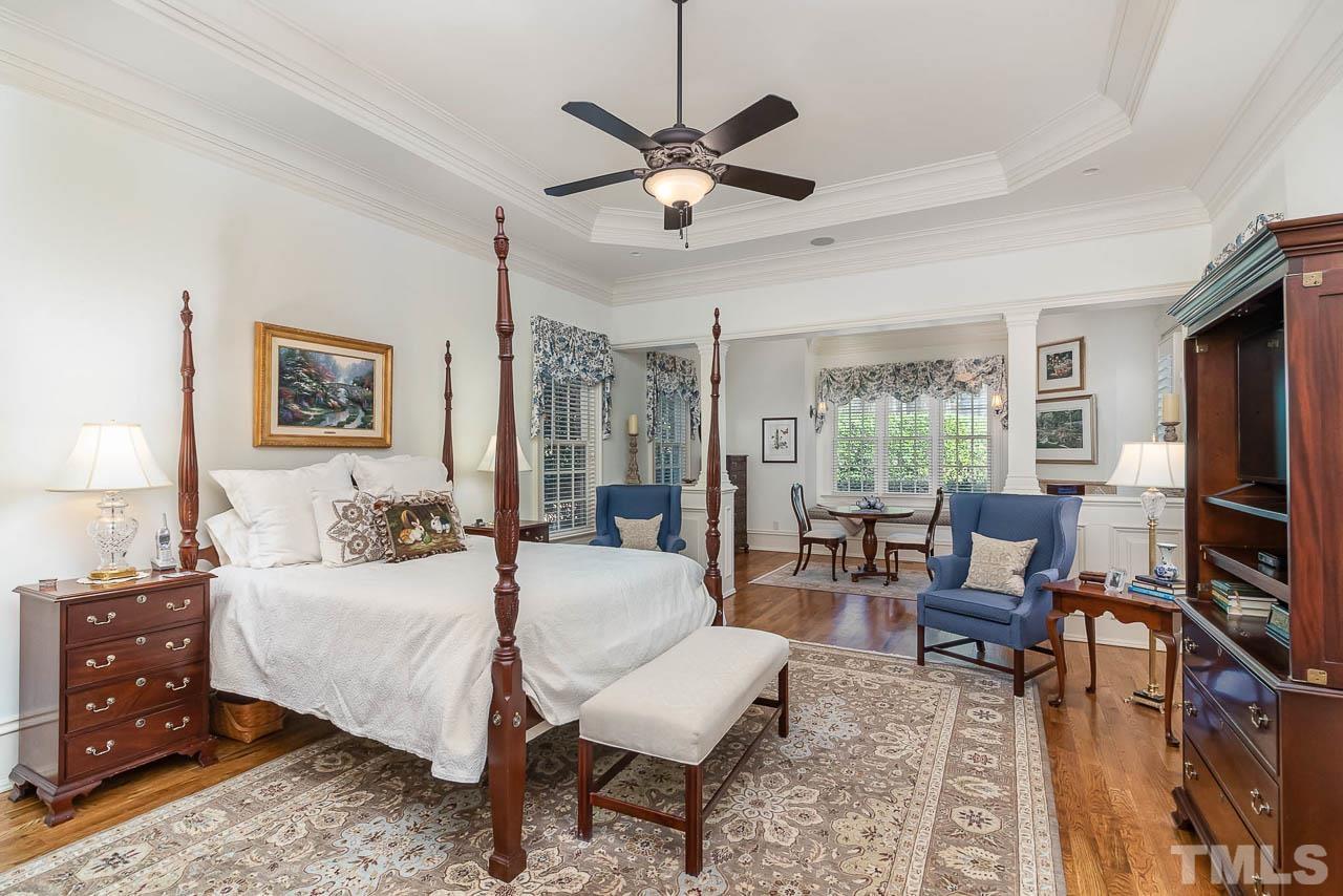 This master suite offers everything one could want in a bedroom. Equipped with it's own sitting room with a fireplace and window seats as well. This master also has a large walking closet with plenty of shelving and a built-ironing board.