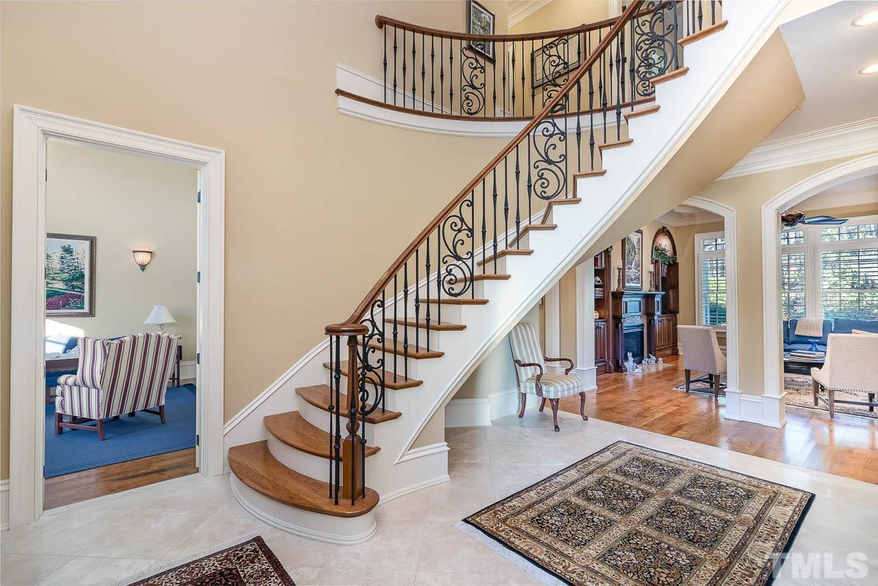 This home offers a large foyer with tile flooring and a circular wood and iron staircase. Additionally the home is hard wired with an entertainment system that transmits satellite TV, AM-FM Radio, Sirus radio, and ect.