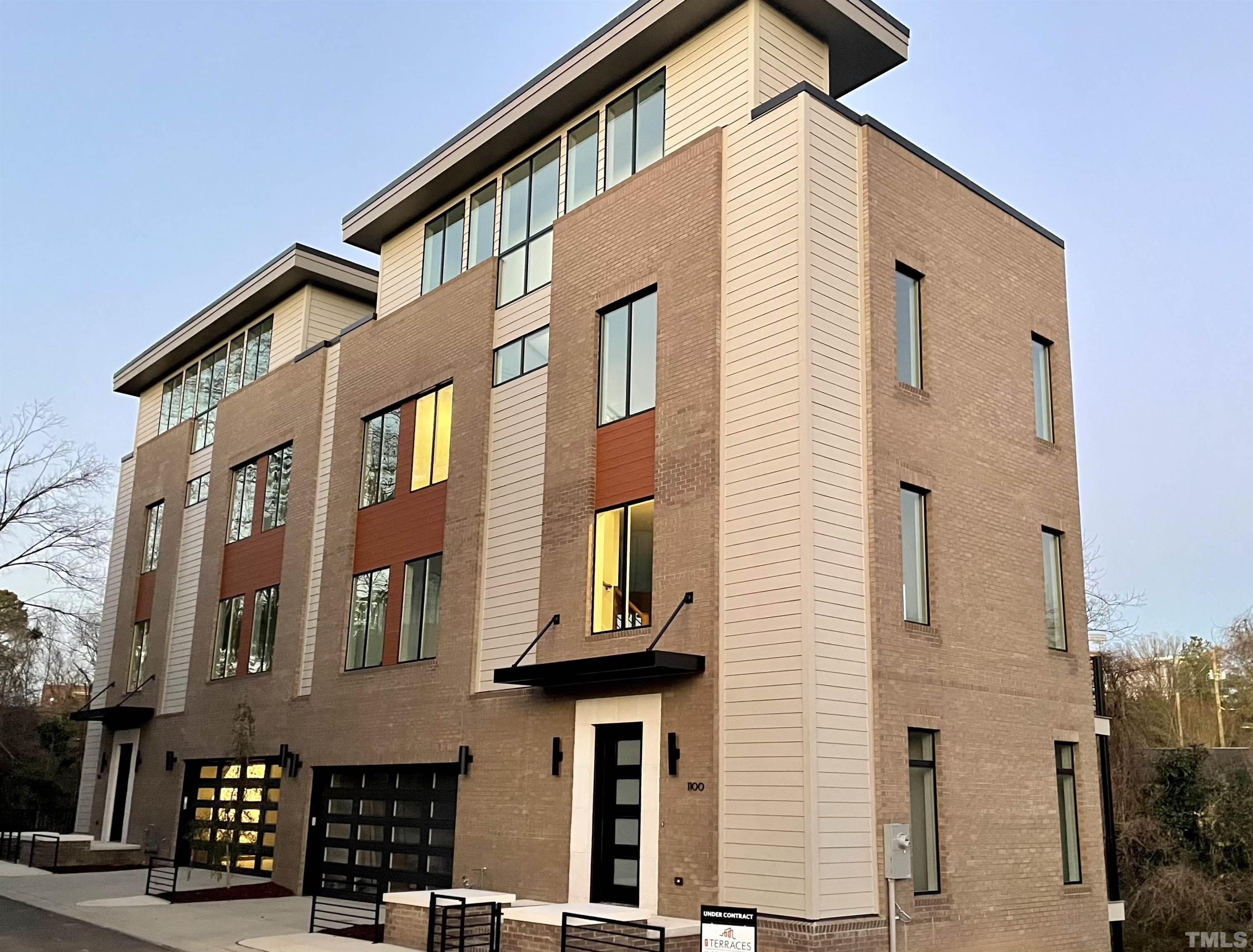 This photo shows the two completed Veranda units Phase 1, and expect a near carbon copy for Phase 2. Front elevation is on Manor Way with rooftop facing Downtown Durham and American Tobacco Trails.