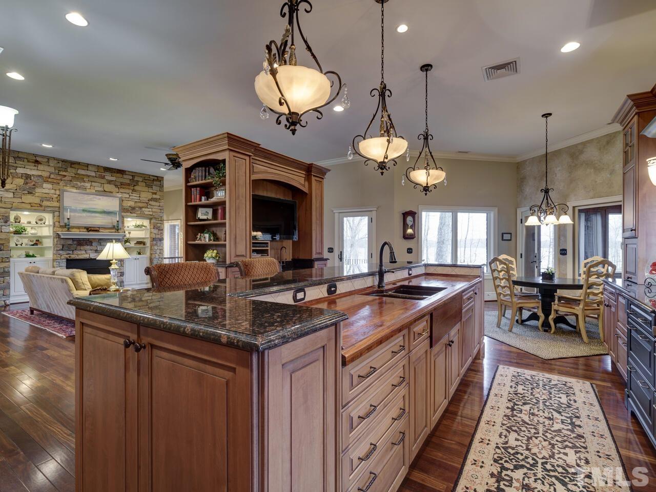 The custom Kitchen is discreetly open to overlook the Great Room.