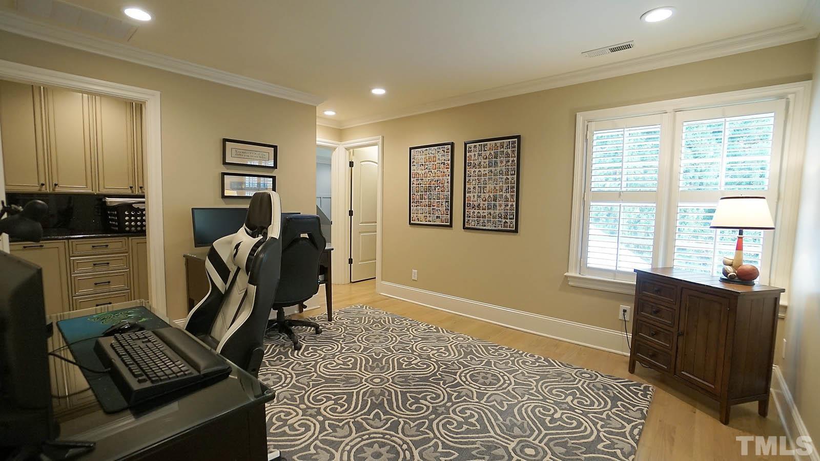 Large office/playroom/study with large walk in closet.