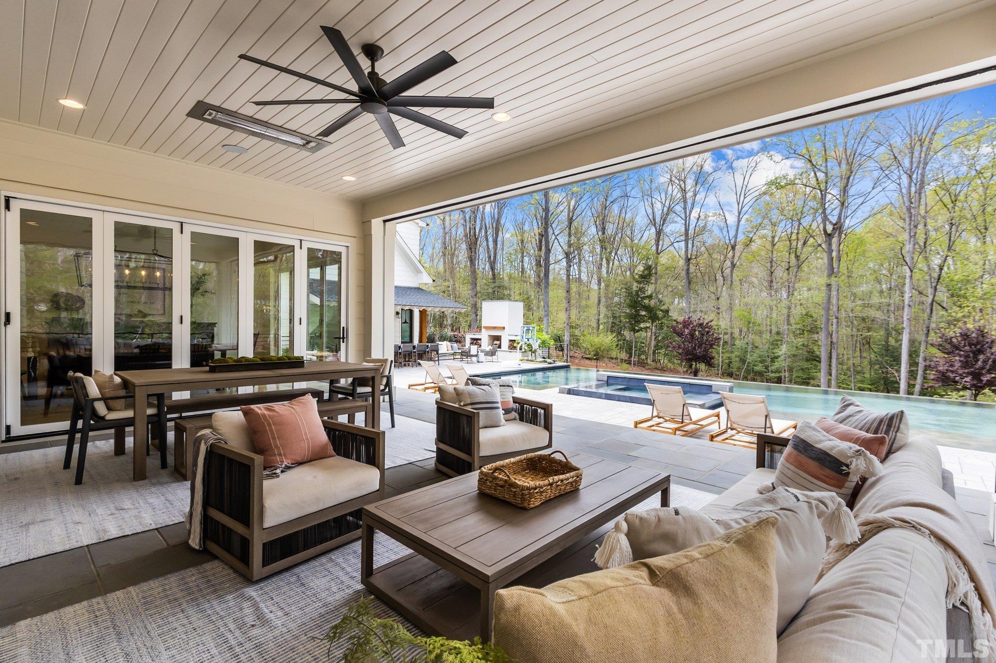 The special doors to the screened porch from both the dining room and the living room open accordion style so they effectively disappear making it not only an open floor plan but like living outdoors while you are indoors.