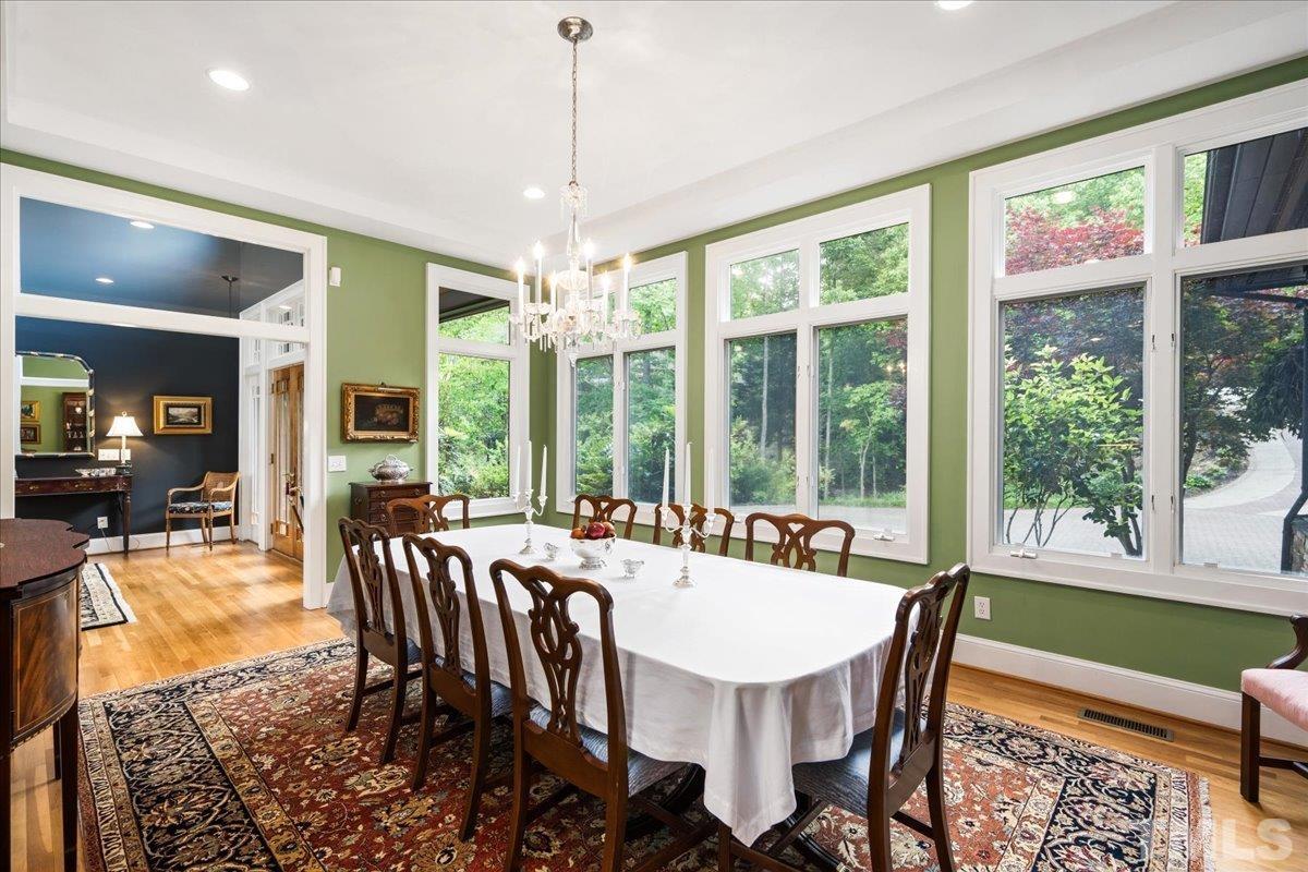 Now this is a dining room to brag about! You will be envied with this dining/entertaining space.  Seat 12+ comfortably with plentiful walk around space.  Sure to fit most all dining room furnishings.
