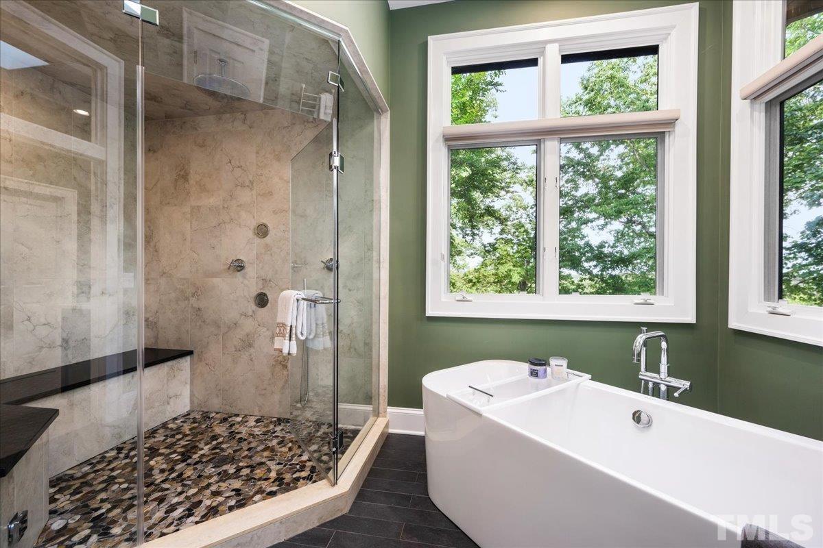 Completely Renovated recent with Steam tile/natural stone shower, Separate free standing modern soaking tub, Towel warmer, Toto heated self cleaning toilet in water closet with Bidet. Beautiful natural light adorns this room