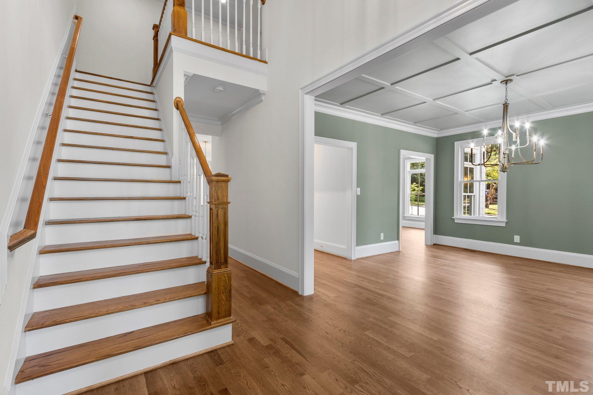 Welcome! Foyer through the front door. Dining room to your right and bedroom 4 or study to your left. Featuring hardwood floors and extensive crown molding throughout 1st floor.