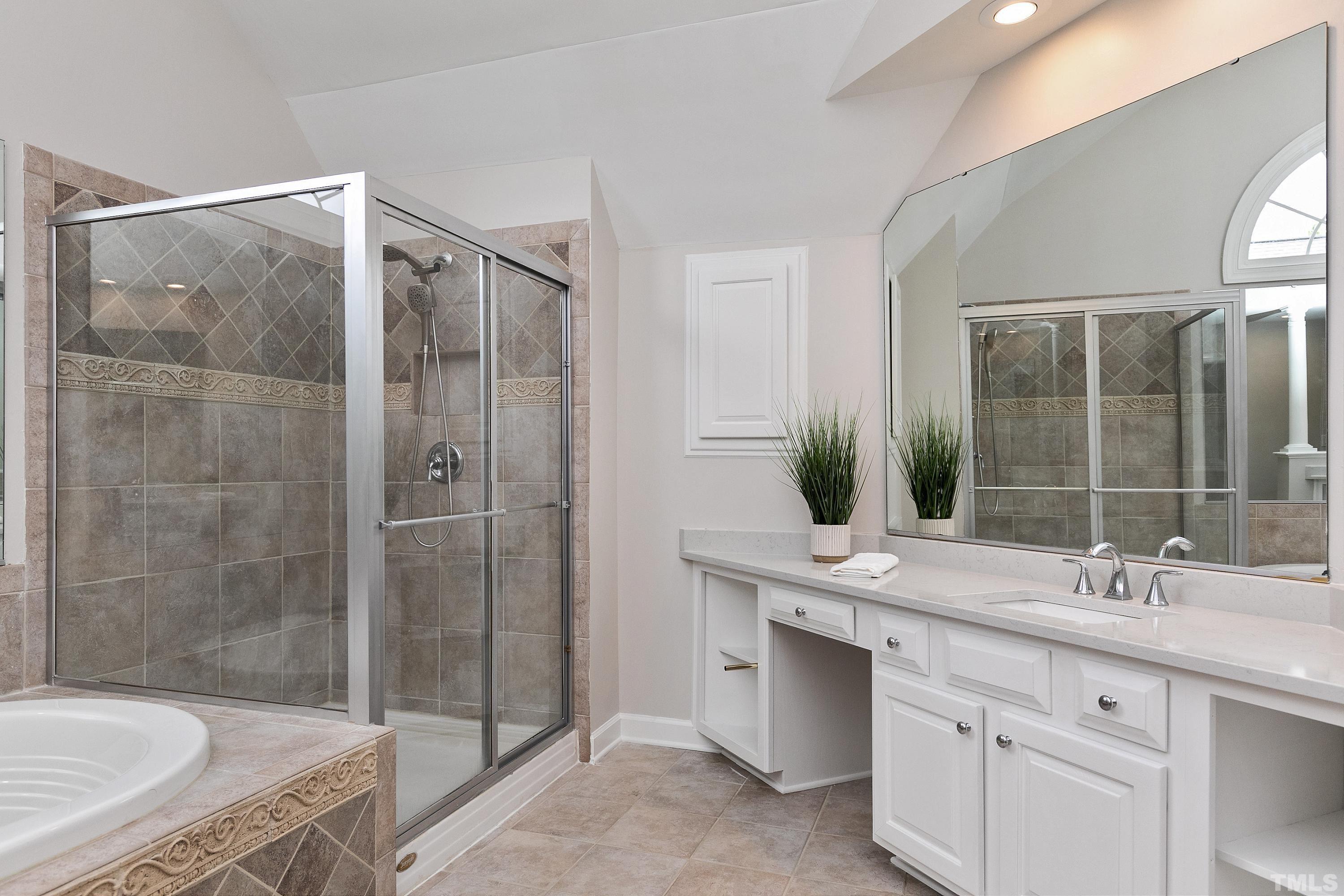 Luxury bath with whirlpool tub, walk in shower and 2 vanities with QUARTZ tops!