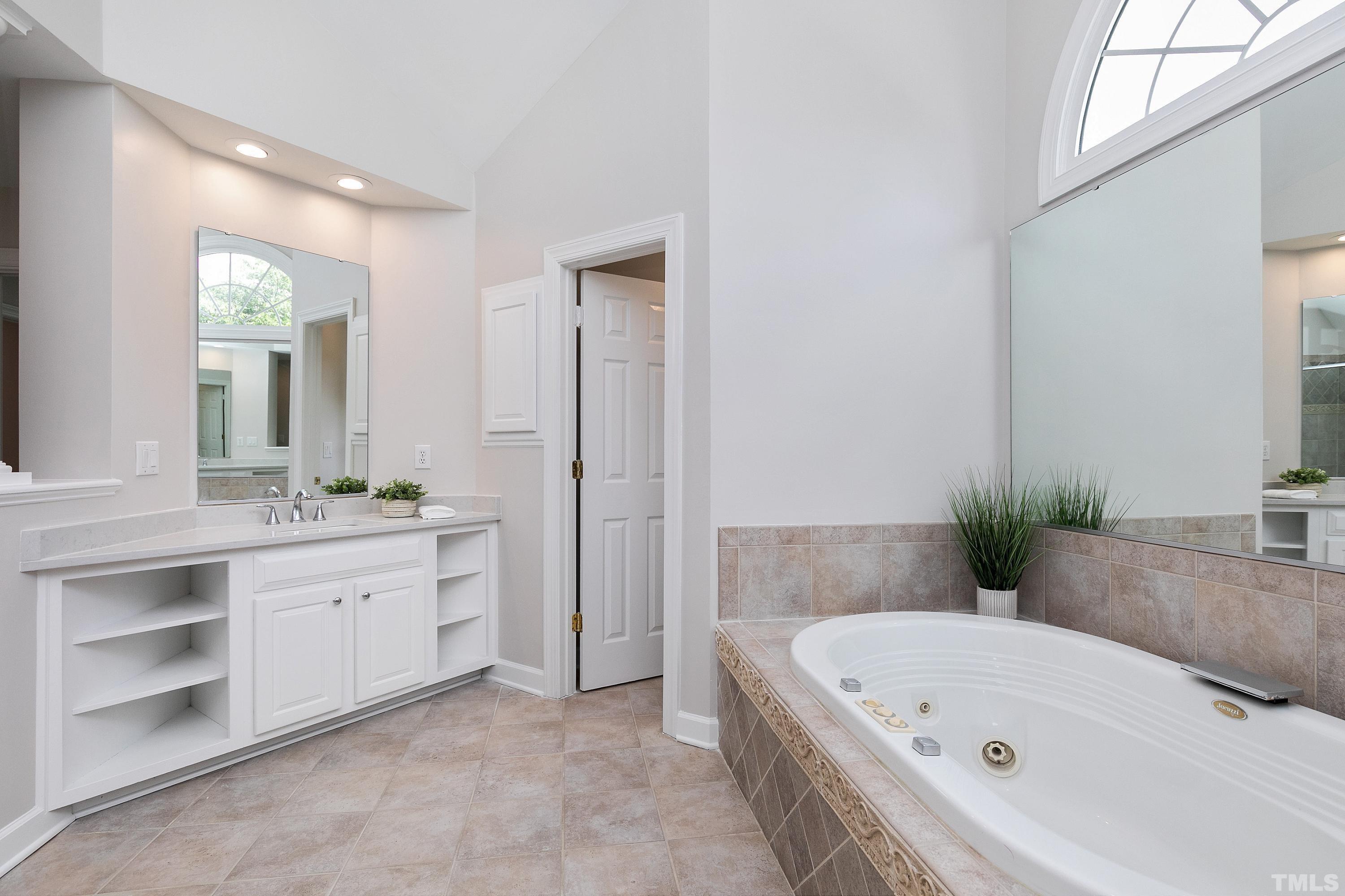 Luxury bath with whirlpool tub, walk in shower and 2 vanities with QUARTZ tops!