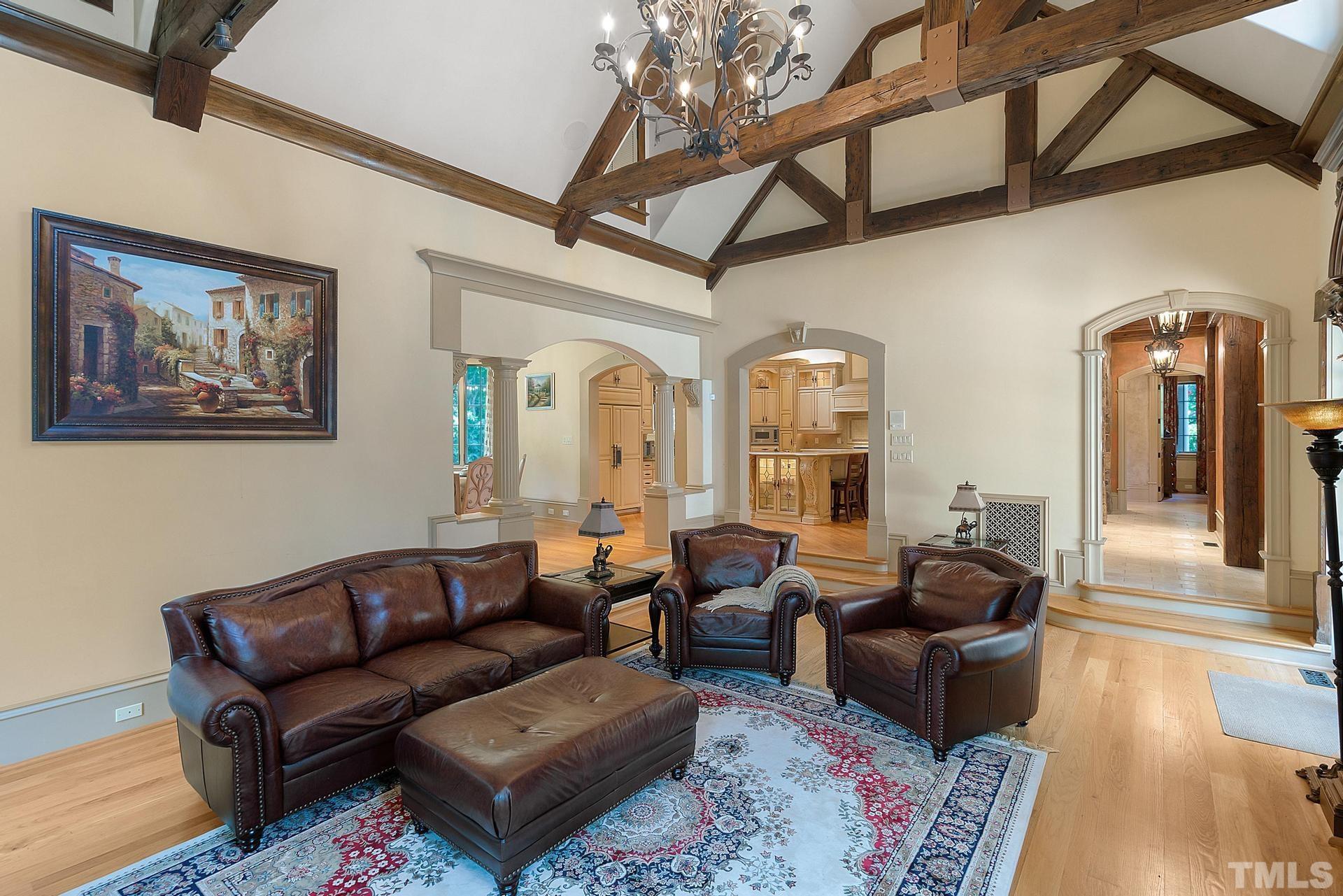 Exposed wooden hammerbeams and the stone fireplace  exude comfort.