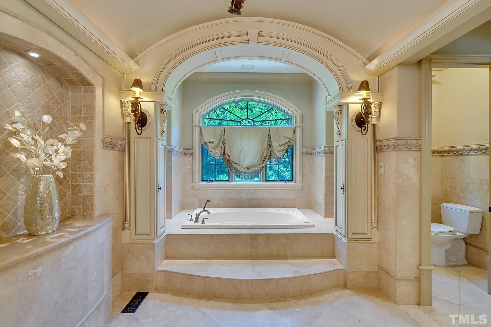 Luxurious spa bathroom with a jacuzzi tub.