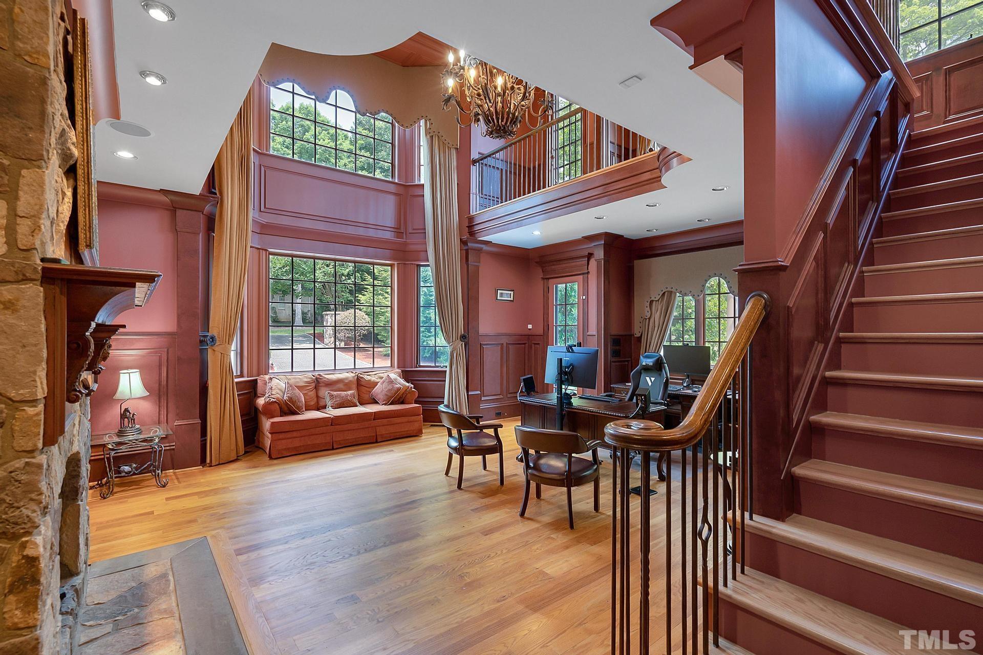 Two story library with private access to the stone patio, a second story mezzanine and secret door access to the hallway.