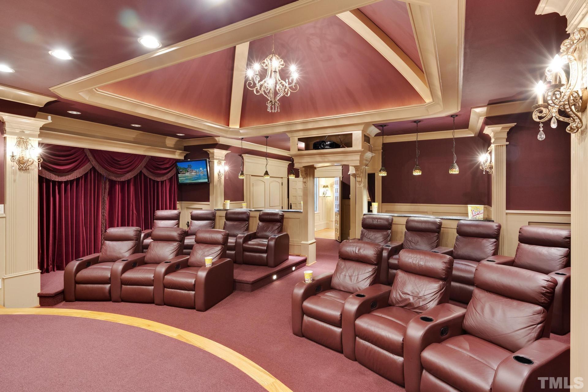 Feel like you are in an actual movie theater! 14 theater seats that recline and have drink holders. Stadium seating. Stadium lighting. Velvet Curtains. There is a stage as well for musical events, not just movies can be enjoyed here!