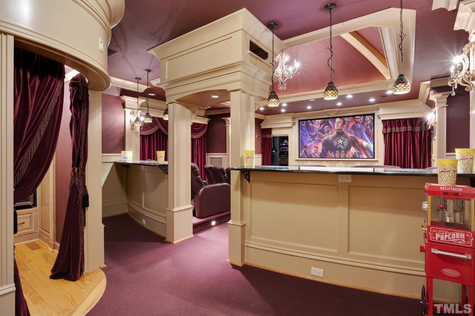 Feel like you are in an actual movie theater! 14 theater seats that recline and have drink holders. Stadium seating. Stadium lighting. Velvet Curtains. There is a stage as well for musical events, not just movies can be enjoyed here!