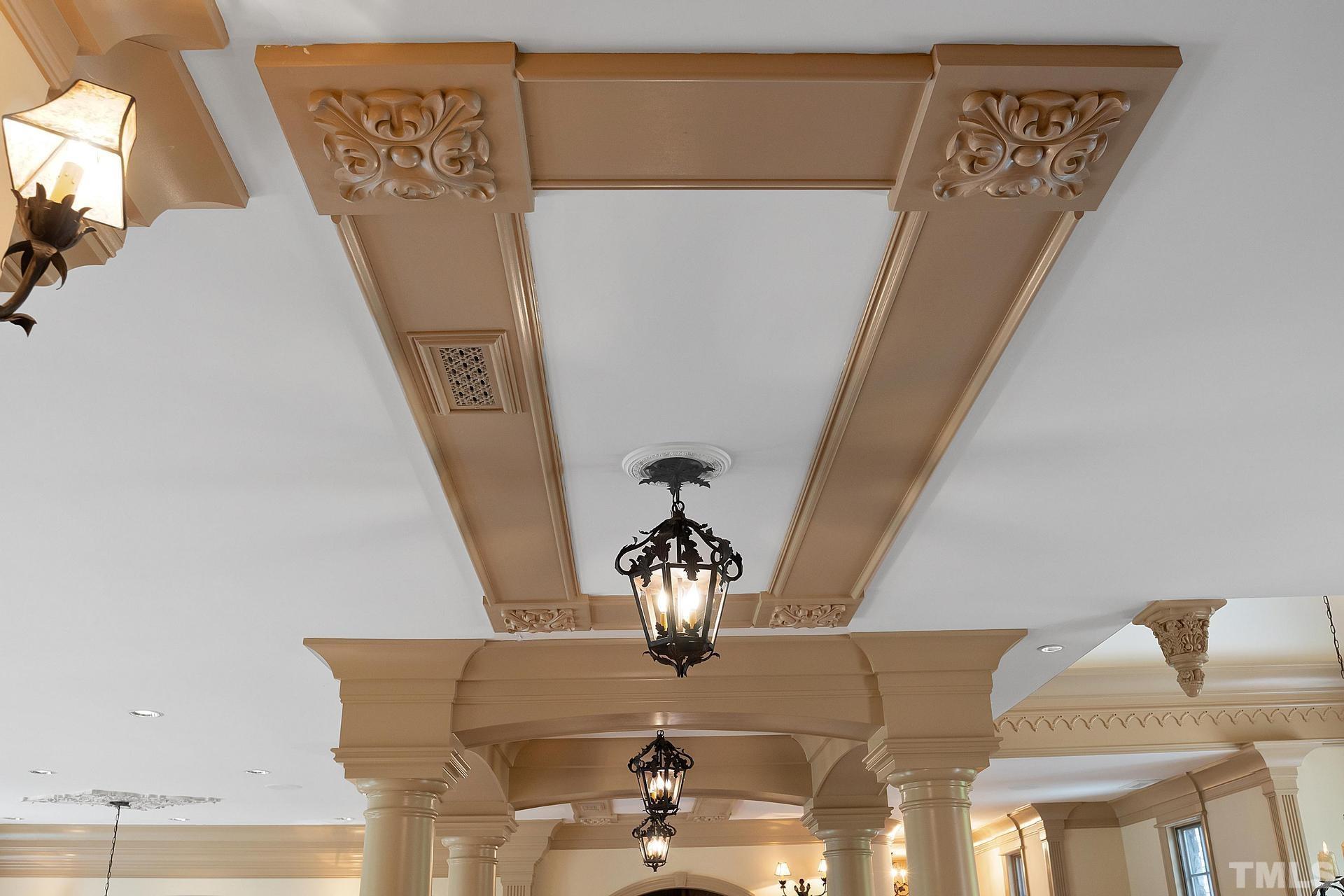 Foyer Ceiling. Extensive trim detail abounds in the home.