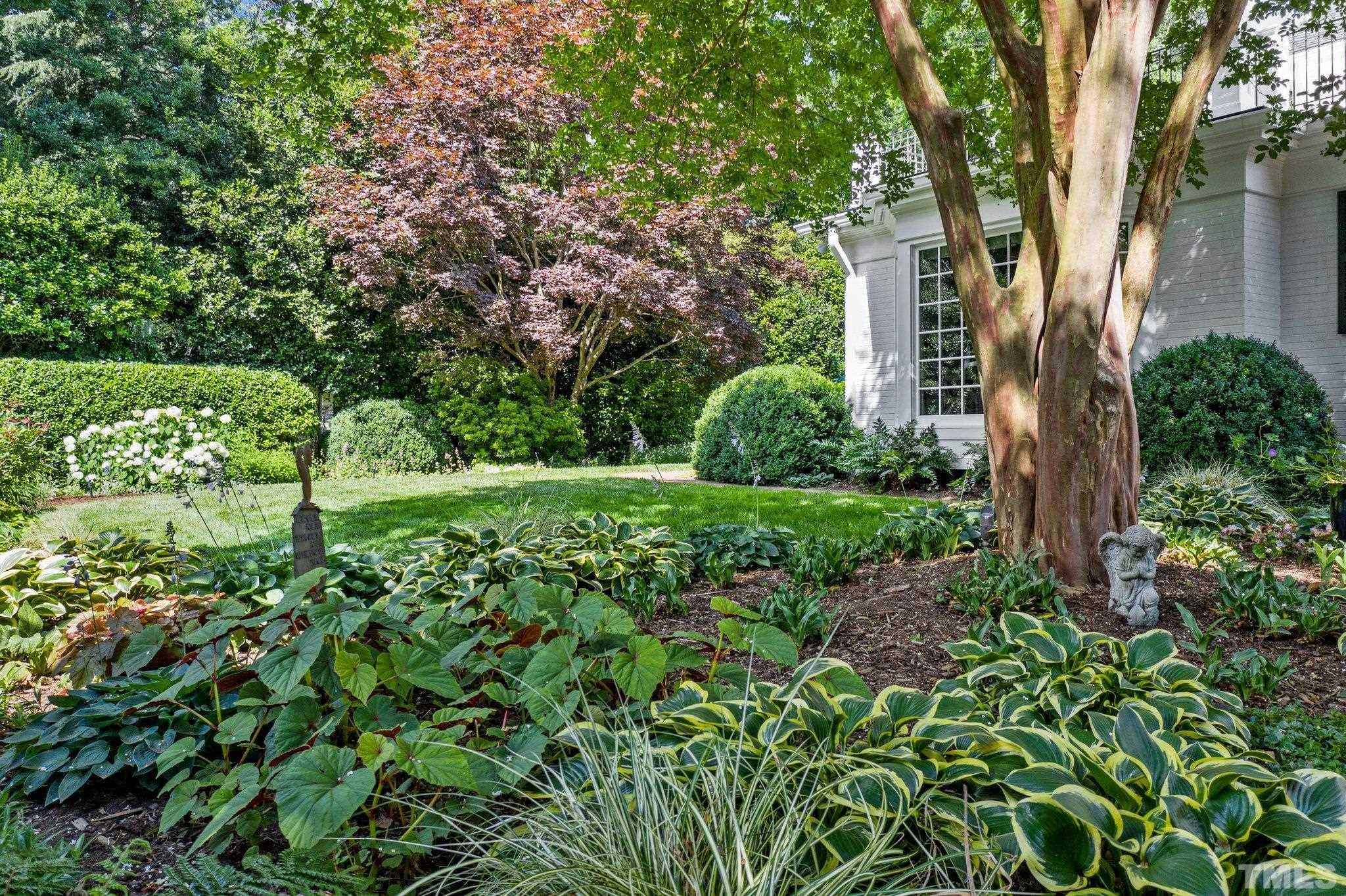 The center garden in the backyard is one of the most breath taking views. A lot of love and care has gone into the upkeep of this home and its exterior treasures.