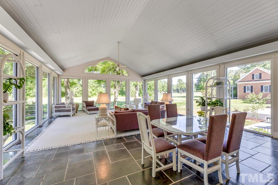 Spacious sunroom overlooking golf course