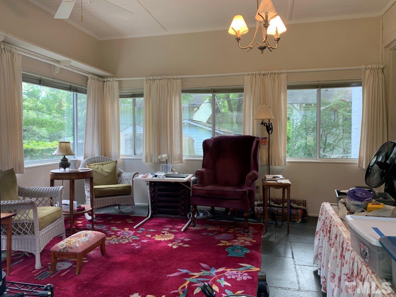 The sunroom overlooks the beautifully landscaped lot.