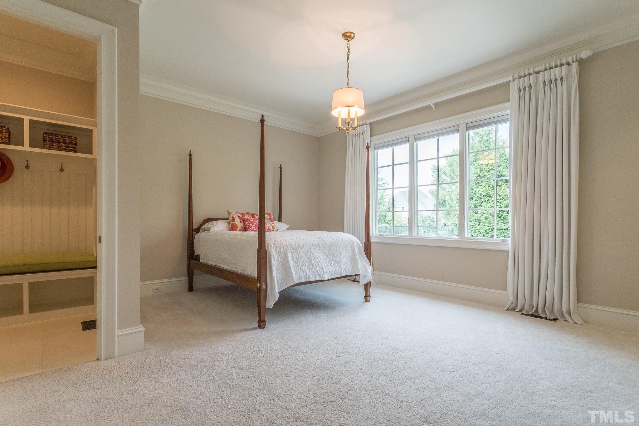 This downstairs suite has a private entry making this perfect for guests, family, or a second master suite option