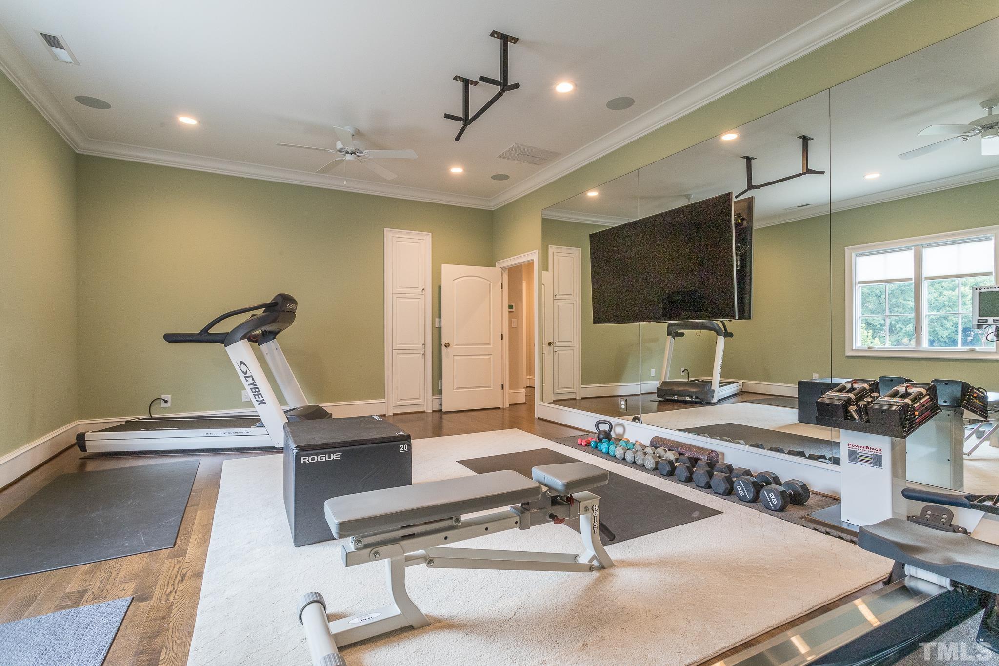 This room has endless possibilities as a home exercise/yoga room, office, theatre room, or craft room. It is connected a full bathroom.