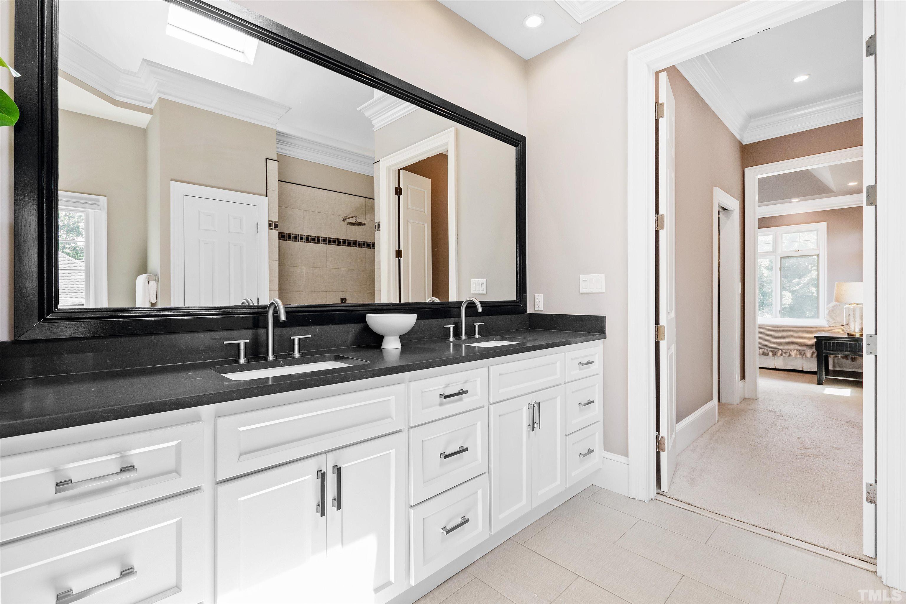Dual vanities with soft-close drawers and quartz countertops